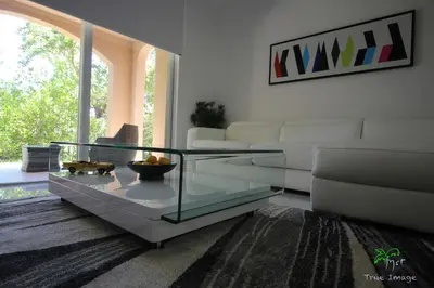 a living room with a glass coffee table at Yacht Club at Aventura 2 Bed 2 bath Luxurius Cozy Brand New in Aventura