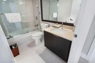 a bathroom with a sink and a toilet and a shower at 4 BDR Sweeping Bayfront Elegance in Miami