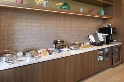 a buffet line in a restaurant with pots and pans at Hilton Miami Dadeland in South Miami