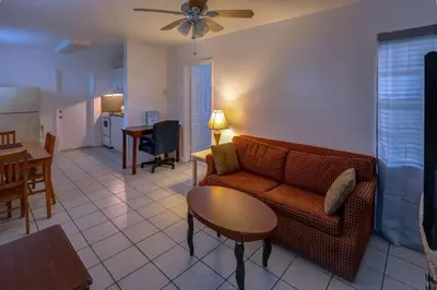 a living room with a couch and a table at Richard's Motel in Hollywood