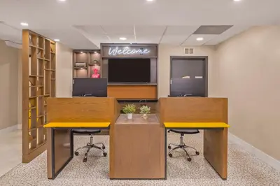 an office with two desks and two stools at B&B Hotel Miami Airport in Miami