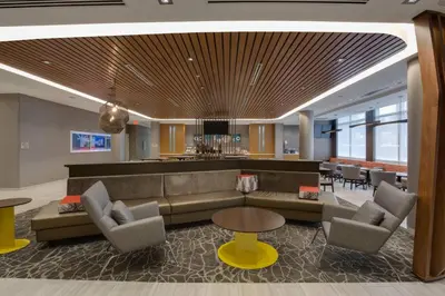 a lobby with a couch and chairs and a table at SpringHill Suites by Marriott Fort Lauderdale Miramar in Miramar