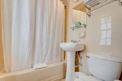 a bathroom with a sink and a toilet and a shower at James Hotel in Miami Beach