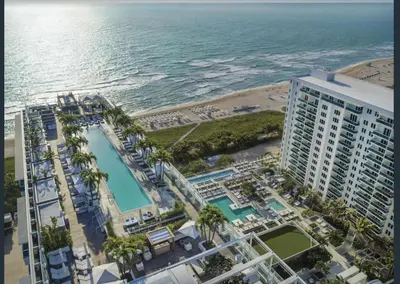 an aerial view of a hotel and the ocean at 1 Hotel & Homes Miami Beach Oceanfront Residence Suites By Joe Semary in Miami Beach