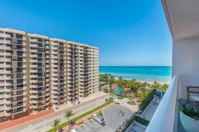 a view of the beach from the balcony of a building at 1 Hotel & Homes Miami Beach Oceanfront Residence Suites By Joe Semary in Miami Beach