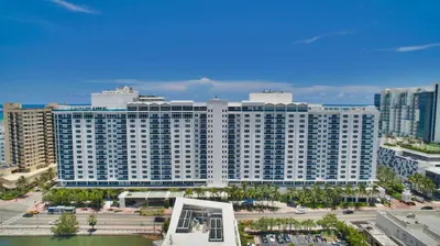 an aerial view of a large white building at 1 Hotel & Homes Miami Beach Oceanfront Residence Suites By Joe Semary in Miami Beach
