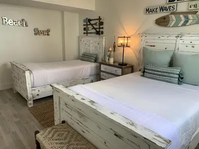 two beds in a room with two beds sidx sidx sidx at Direct Ocean View Condo at Tides of Hollywood - 7N in Hollywood