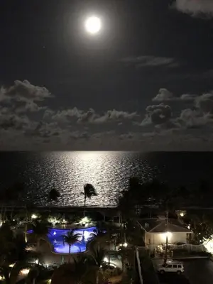 a full moon over the ocean at night at Direct Ocean View Condo at Tides of Hollywood - 7N in Hollywood