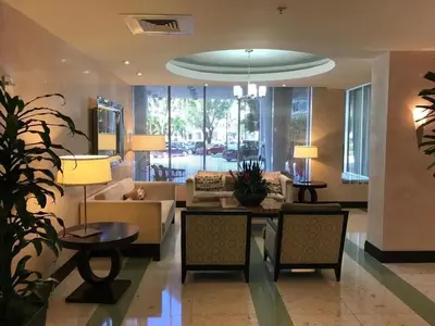 a living room with a couch and a table at Direct Ocean View Condo at Tides of Hollywood - 7N in Hollywood