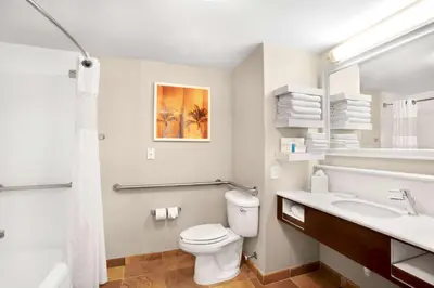 a bathroom with a white toilet and a sink at Hampton Inn Hallandale Beach-Aventura in Hollywood
