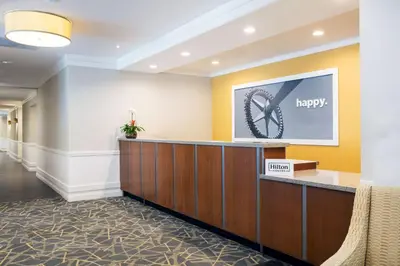 a hotel lobby with a happy sign on the wall at Hampton Inn Hallandale Beach-Aventura in Hollywood