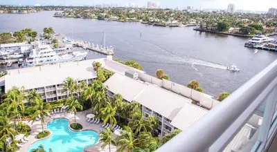a view of the water from the balcony of a resort at Hilton Fort Lauderdale Marina in Fort Lauderdale