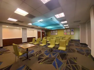 a conference room with chairs and a table in it at Holiday Inn Express & Suites Miami - Hialeah by IHG in Hialeah