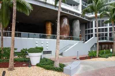 a building with palm trees in front of it at Iconic Views in Miami