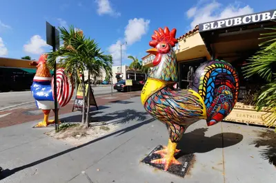 a colorful statue of a rooster on the side of a street at Iconic Views in Miami