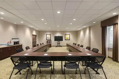 a large conference room with a large table and chairs at Hampton Inn Pembroke Pines in Pembroke Pines