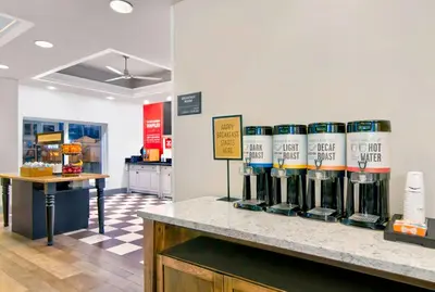 a store with a bunch of bottles of wine on a counter at Hampton Inn Ft Lauderdale Airport North Cruise Port in Fort Lauderdale