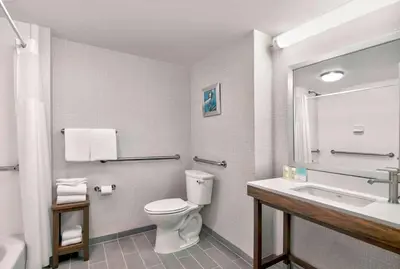 a bathroom with a toilet and a sink at Hampton Inn Ft Lauderdale Airport North Cruise Port in Fort Lauderdale