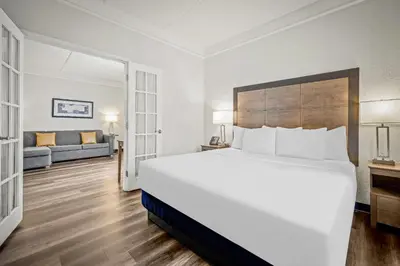 a large white bedroom with a large bed and a couch at La Quinta by Wyndham Miami Airport West in Miami