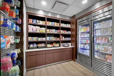 a store aisle of a grocery store with food at La Quinta by Wyndham Miami Airport West in Miami