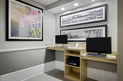 a office with a desk with a computer on it at La Quinta by Wyndham Miami Airport West in Miami
