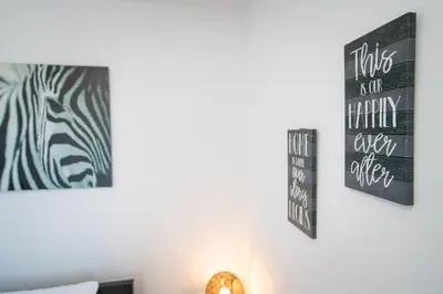 a room with a zebra picture on the wall at Apartments in the Heart of Miami - Port of Miami / Miami Airport in Miami