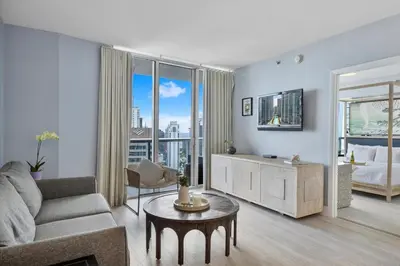 a living room with a couch and a tv at Marvelous apartment in Brickell in Miami