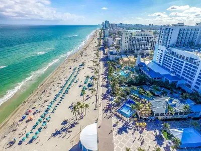 an aerial view of the beach at a resort at Cozy apartment wsteps to beach boardwalk in Hollywood