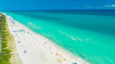 an overhead view of a beach with a group of people at Oceanfront Private Condo at The Setai -2707 in Miami Beach