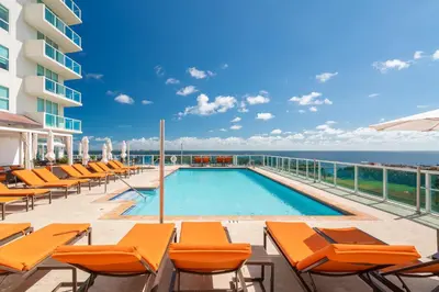 a swimming pool on the balcony of a hotel at City View Balcony steps from Restaurants, Peacock Park & Marina in Miami