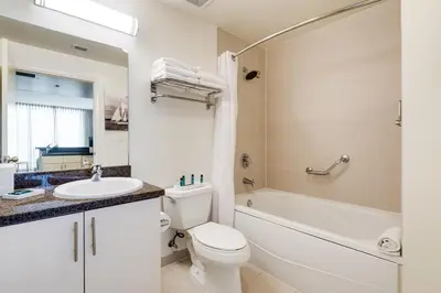 a bathroom with a toilet and a sink and a bath tub at City View Balcony steps from Restaurants, Peacock Park & Marina in Miami
