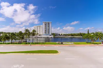 an empty street in front of a large building at Notebook Miami Beach in Miami Beach