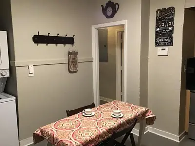 a table in a kitchen with a table cloth on it at Modern 3/1 house close to Beaches and Midtown in Miami