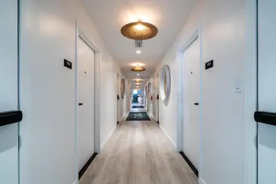 a hallway with white doors and a ceiling at Casa Ocean in Miami Beach
