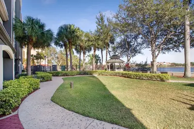 a walkway with a gazebo in a park at La Quinta by Wyndham Ft. Lauderdale Airport in Hollywood