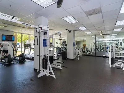 a gym with treadmills and machines in a building at Ocean Reserve 14th floor - Wonderful Ocean View - STR00454 in Miami Beach