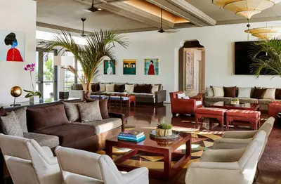 a living room with couches and a table at The Betsy Hotel, South Beach in Miami Beach