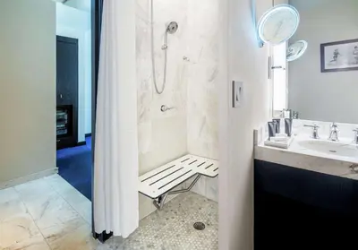 a bathroom with a shower and a sink at Gale South Beach, Curio Collection By Hilton in Miami Beach