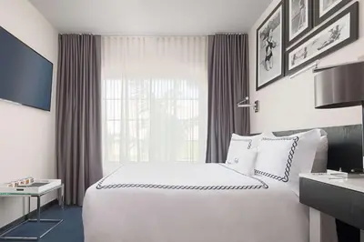 a hotel room with a large bed and a window at Gale South Beach, Curio Collection By Hilton in Miami Beach