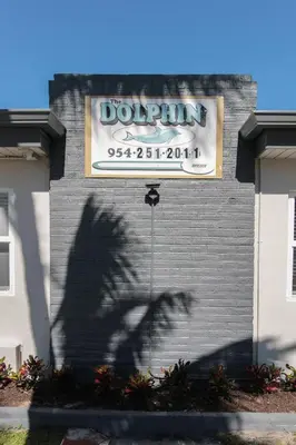 a shadow of a sign on a building with a dojo sign at The Dolphin Hollywood in Hollywood