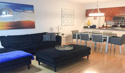 a living room with a couch and a table with chairs at Top Stay Miami Platinum Brickell in Miami