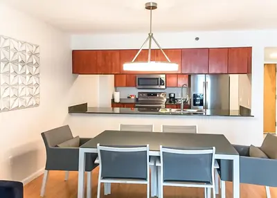 a kitchen and dining room with a table and chairs at Top Stay Miami Platinum Brickell in Miami