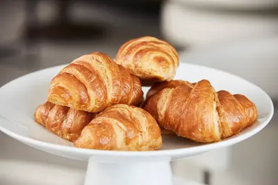 a plate of croissants on a white plate at AC Hotel by Marriott Miami Airport West/Doral in Miami