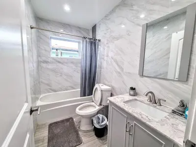 a bathroom with a toilet and a sink and a shower at Downtown Hollywood - 3 miles to Beach - Sleeps 8 in Hollywood
