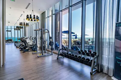 a gym with a view of the ocean at Private Ocean Condos at Hyde Beach Resort & Residences in Hollywood