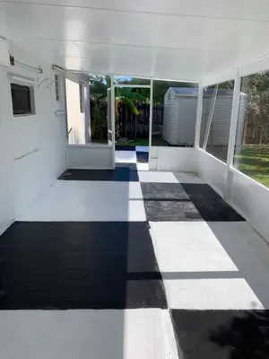 a room with a black and white checkered floor at waterfront lake Hollywood hard rock Airport in Dania Beach