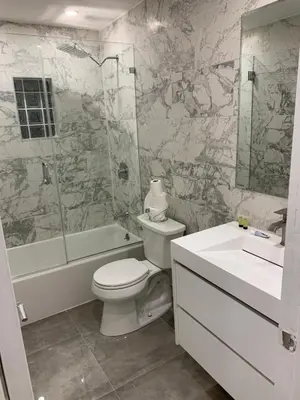 a bathroom with a toilet and a shower and a sink at waterfront lake Hollywood hard rock Airport in Dania Beach