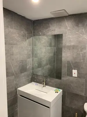 a bathroom with a sink and a mirror at waterfront lake Hollywood hard rock Airport in Dania Beach