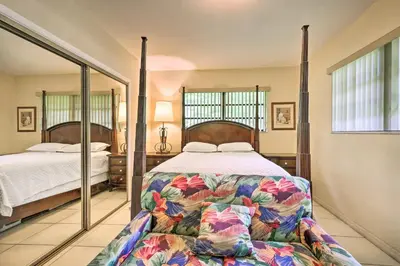 a bedroom with two beds and a large mirror at 7545 Southwest 124th Street in Miami