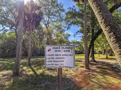 a sign in a park with a park closed crook san at Flamingo Place - One block to Lauderdale Marine Center - 3 bedroom - 2 bath - King bed in Fort Lauderdale